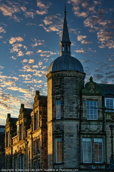 Historic stone building with a spire against a dramatic sky with golden sunset clouds in Lancaster. Picture Board by Man And Life