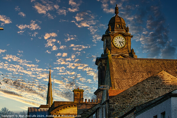 Historic clock tower against a vibrant sunset sky with scattered clouds in Lancaster. Picture Board by Man And Life