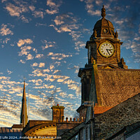 Buy canvas prints of Historic clock tower against a vibrant sunset sky with scattered clouds in Lancaster. by Man And Life