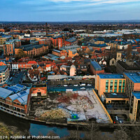 Buy canvas prints of Aerial view of a modern cityscape during sunset with buildings and a river in York, North Yorkshire by Man And Life