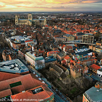Buy canvas prints of Aerial view of a European city at sunset with warm lighting, showcasing historic buildings and urban landscape in York, North Yorkshire by Man And Life