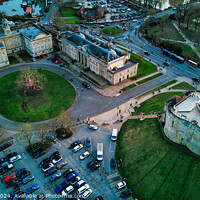 Buy canvas prints of Aerial view of a historic cityscape with a roundabout, ancient buildings, and a fortress at dusk in York, North Yorkshire by Man And Life