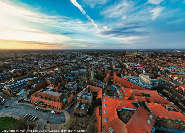 Aerial view of a European city at dusk with historic buildings and a dramatic sky in York, North Yorkshire Picture Board by Man And Life