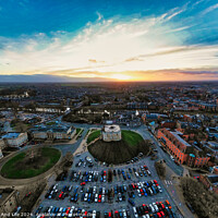 Buy canvas prints of Aerial view of a cityscape at sunset with vibrant skies and parking lot in the foreground in York, North Yorkshire by Man And Life