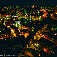 Buy canvas prints of Aerial night view of a vibrant cityscape with illuminated streets and buildings in Leeds, UK. by Man And Life
