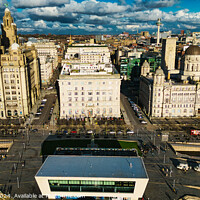 Buy canvas prints of Aerial view of Liverpool's historic waterfront buildings under a dramatic sky. by Man And Life