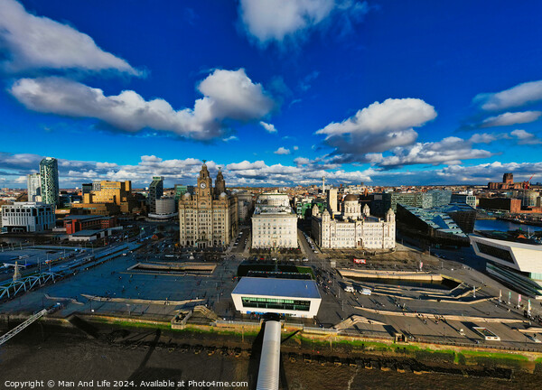 Panoramic view of a modern cityscape under a blue sky with fluffy clouds in Liverpool, UK. Picture Board by Man And Life