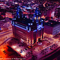 Buy canvas prints of Aerial night view of an illuminated historic building in an urban cityscape in Liverpool, UK. by Man And Life