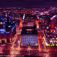Buy canvas prints of Aerial night view of a vibrant cityscape with illuminated buildings and streets in Liverpool, UK. by Man And Life
