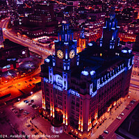 Buy canvas prints of Aerial night view of an illuminated historic building amidst city streets with vibrant red traffic trails in Liverpool, UK. by Man And Life