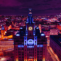 Buy canvas prints of Aerial night view of an illuminated historic building in an urban landscape with vibrant purple skies in Liverpool, UK. by Man And Life