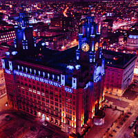 Buy canvas prints of Aerial night view of an illuminated historic building in an urban cityscape with vibrant purple skies in Liverpool, UK. by Man And Life