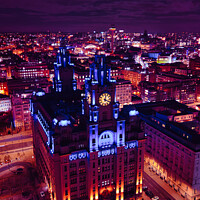 Buy canvas prints of Aerial night view of an illuminated historic building in an urban cityscape with vibrant purple skies in Liverpool, UK. by Man And Life