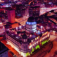 Buy canvas prints of Aerial night view of an illuminated historic building in an urban setting, showcasing vibrant city lights and architecture in Liverpool, UK. by Man And Life