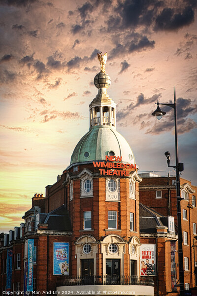 Dramatic sky over Wimbledon Theatre with golden sunset light illuminating the building's facade and dome. Picture Board by Man And Life