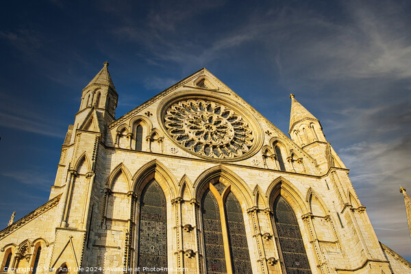 Gothic cathedral facade with rose window under blue sky in York, UK. Picture Board by Man And Life