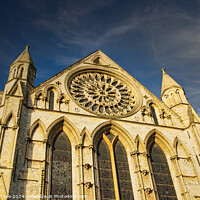 Buy canvas prints of Gothic cathedral facade with rose window under blue sky in York, UK. by Man And Life
