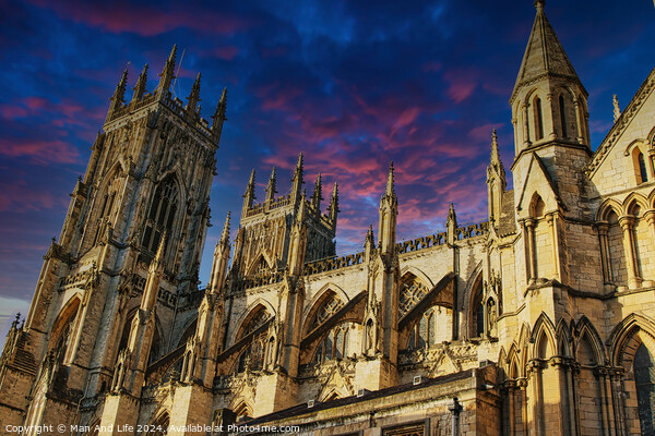 Majestic medieval cathedral against a vibrant sunset sky in York, UK. Picture Board by Man And Life