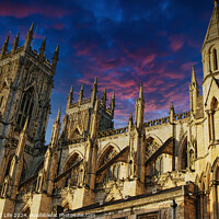 Buy canvas prints of Majestic medieval cathedral against a vibrant sunset sky in York, UK. by Man And Life