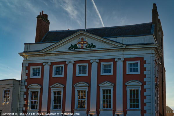 Classic red and white building facade with clear blue sky at dusk in York, UK. Picture Board by Man And Life