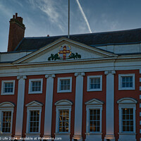 Buy canvas prints of Classic red and white building facade with clear blue sky at dusk in York, UK. by Man And Life