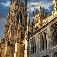Buy canvas prints of Gothic cathedral against a dramatic sky at sunset, showcasing intricate architecture and historical grandeur in York, UK. by Man And Life
