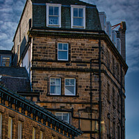 Buy canvas prints of Vintage building corner against a dramatic cloudy sky in Harrogate, England. by Man And Life