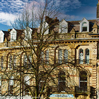 Buy canvas prints of Vintage building corner against a dramatic cloudy sky in Harrogate, England. by Man And Life