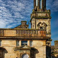 Buy canvas prints of Historic stone building with a tower under a blue sky with textured clouds in Harrogate, England. by Man And Life