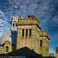 Buy canvas prints of Historic stone building with a dome under a blue sky with clouds in Harrogate, England. by Man And Life
