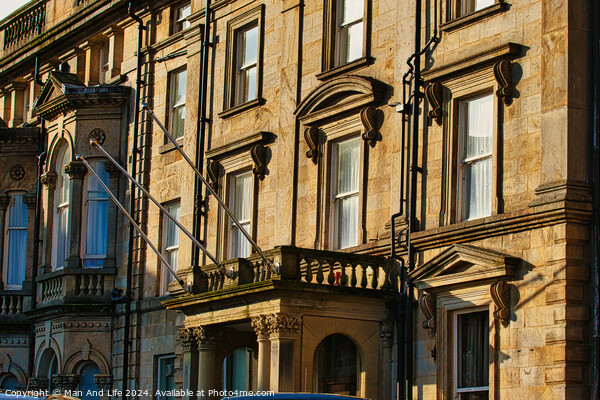 Sunlit classic European architecture with ornate facades and windows in Harrogate, England. Picture Board by Man And Life