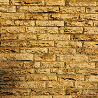 Buy canvas prints of Seamless texture of a yellow brick wall, perfect for background or pattern use in design projects . by Man And Life