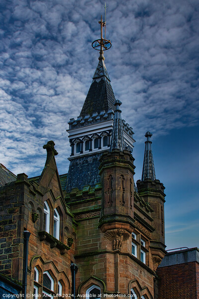 Gothic-style tower against a dramatic sky, architectural detail and historical building concept in Harrogate, England. Picture Board by Man And Life