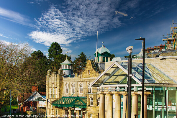 Sunny day over historic buildings with blue sky and fluffy clouds in Harrogate, England. Picture Board by Man And Life