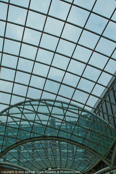 Modern glass ceiling architecture with geometric pattern against a blue sky in Leeds, UK. Picture Board by Man And Life