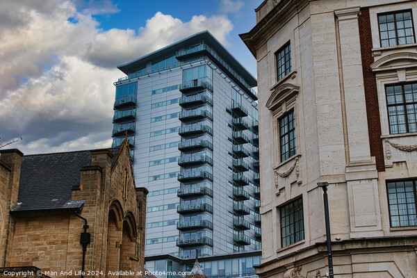 Modern glass skyscraper towering over historic buildings under a cloudy sky in Leeds, UK. Picture Board by Man And Life