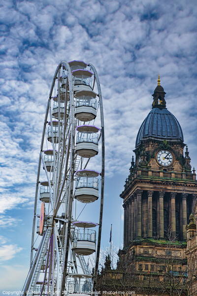 Ferris wheel beside a historic clock tower under a cloudy sky in Leeds, UK. Picture Board by Man And Life