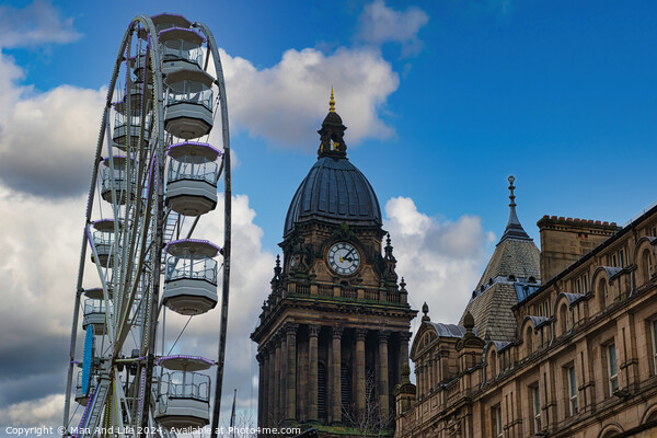 Ferris wheel beside a historic clock tower under a blue sky with clouds in Leeds, UK. Picture Board by Man And Life