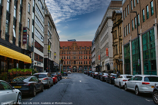 Urban street view with parked cars and historic buildings under a cloudy sky in Leeds, UK. Picture Board by Man And Life