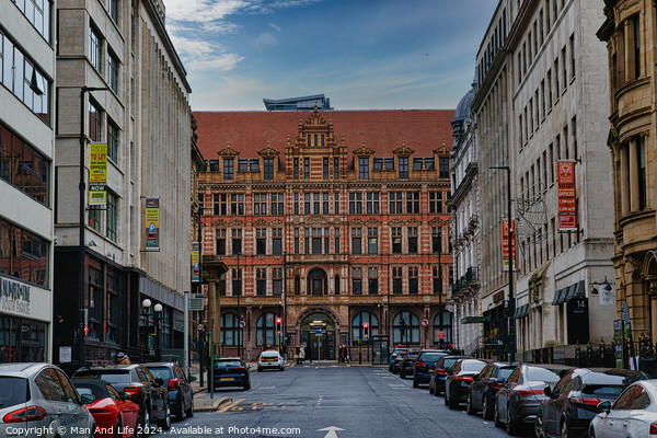 Historic European city street with traditional architecture and parked cars under a cloudy sky in Leeds, UK. Picture Board by Man And Life
