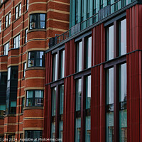 Buy canvas prints of Modern building facade with a pattern of red and brown rectangular windows and panels, architectural background in Leeds, UK. by Man And Life