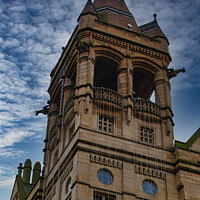 Buy canvas prints of Gothic style tower against a dramatic cloudy sky in Leeds, UK. by Man And Life