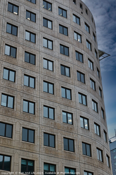 Modern curved office building facade against a clear blue sky in Leeds, UK. Picture Board by Man And Life