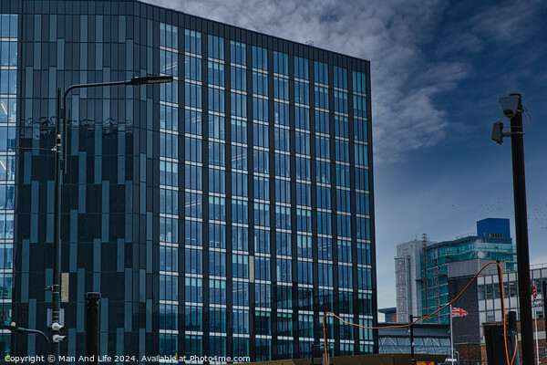 Modern glass office buildings with reflections under blue sky in Leeds, UK. Picture Board by Man And Life