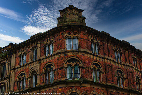 Victorian architecture with ornate windows against a cloudy sky in Leeds, UK. Picture Board by Man And Life