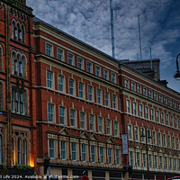 Buy canvas prints of Historic red brick building at dusk with street lamp and dramatic sky in Leeds, UK. by Man And Life