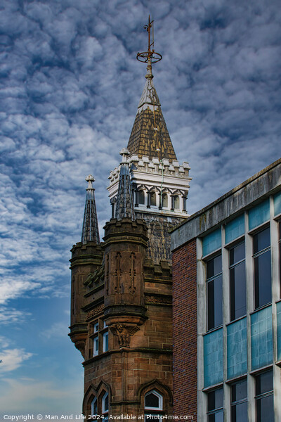 Historic tower with spire against a dramatic cloudy sky, juxtaposed with modern building facade in Leeds, UK. Picture Board by Man And Life