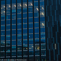 Buy canvas prints of Modern office building facade with reflective glass windows at dusk in Leeds, UK. by Man And Life