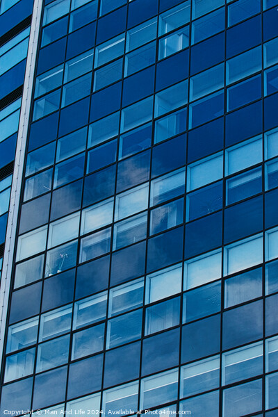 Modern glass building facade reflecting blue sky with clouds, architectural details and textures, urban background in Leeds, UK. Picture Board by Man And Life