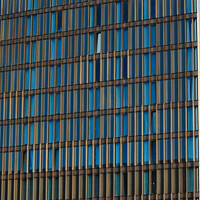 Buy canvas prints of Modern office building facade with blue glass windows and steel structure, architectural background in Liverpool, UK. by Man And Life